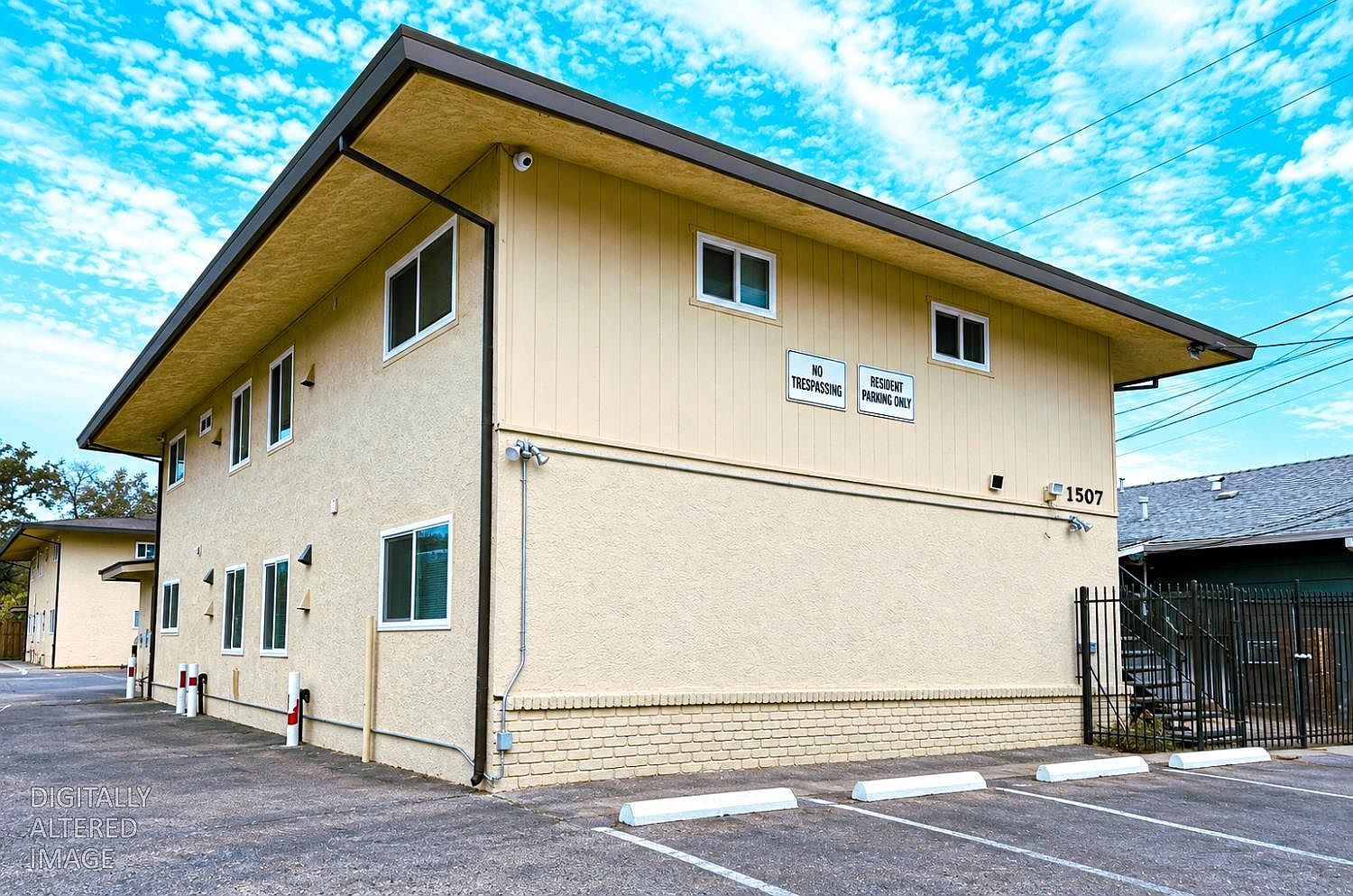 Two-story 8-unit apartment building at 1507 Nogales St, Sacramento, with off-street parking