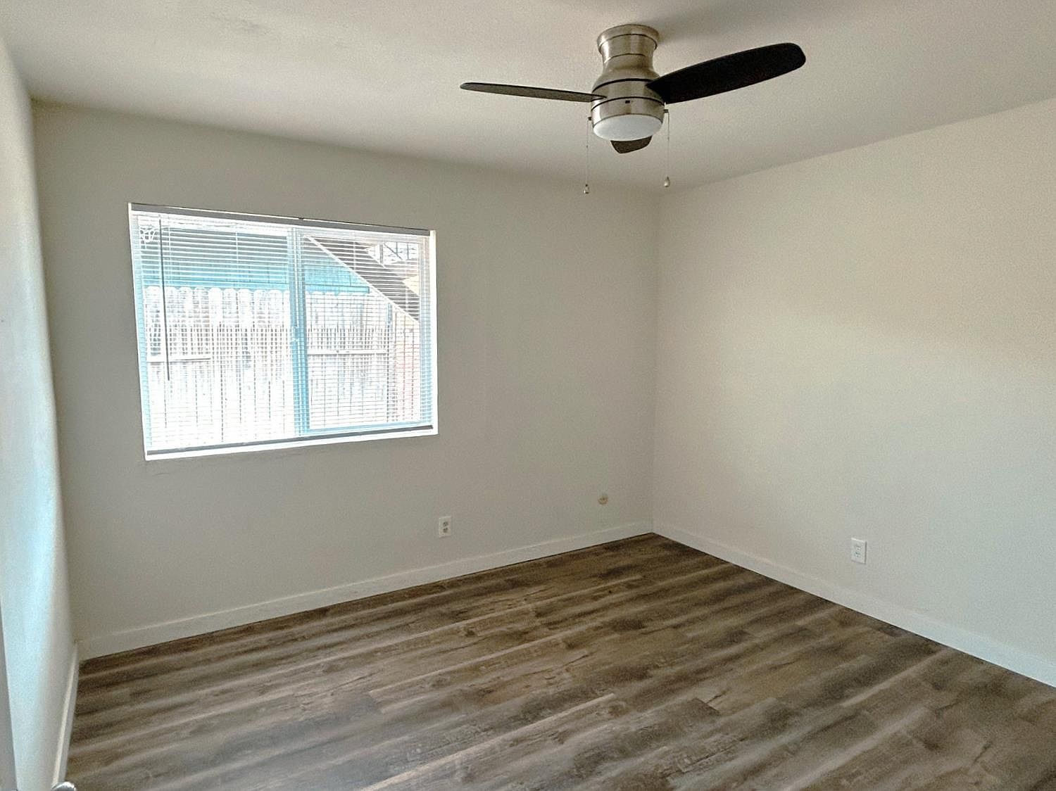 Bedroom with window and ceiling fan