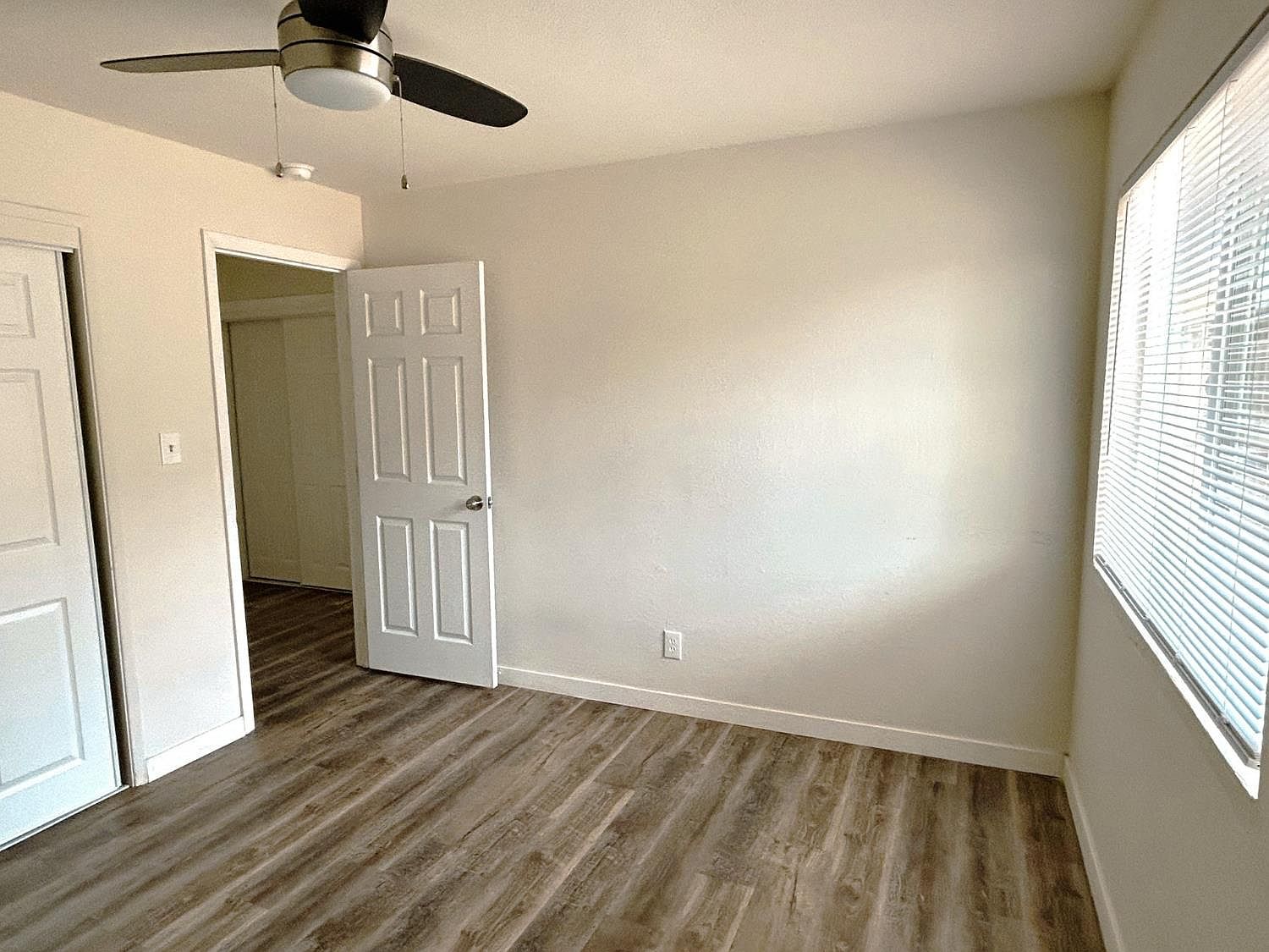Bright bedroom with new vinyl plank flooring