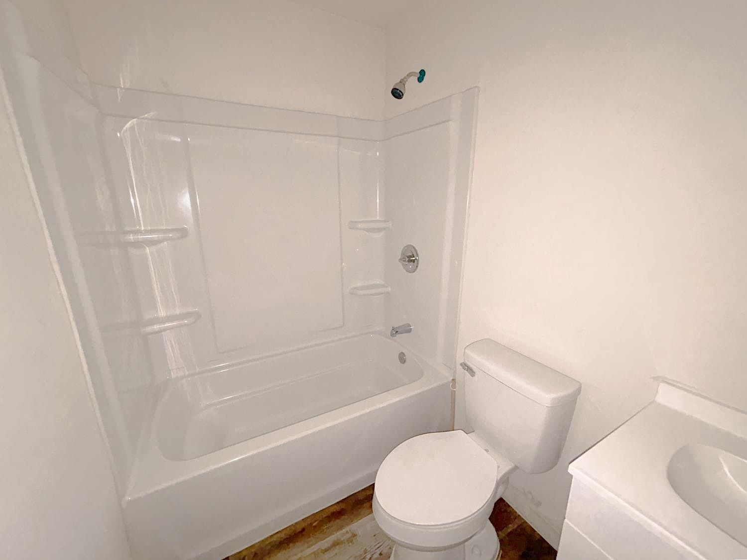 Refreshed bathroom with tub-shower combination