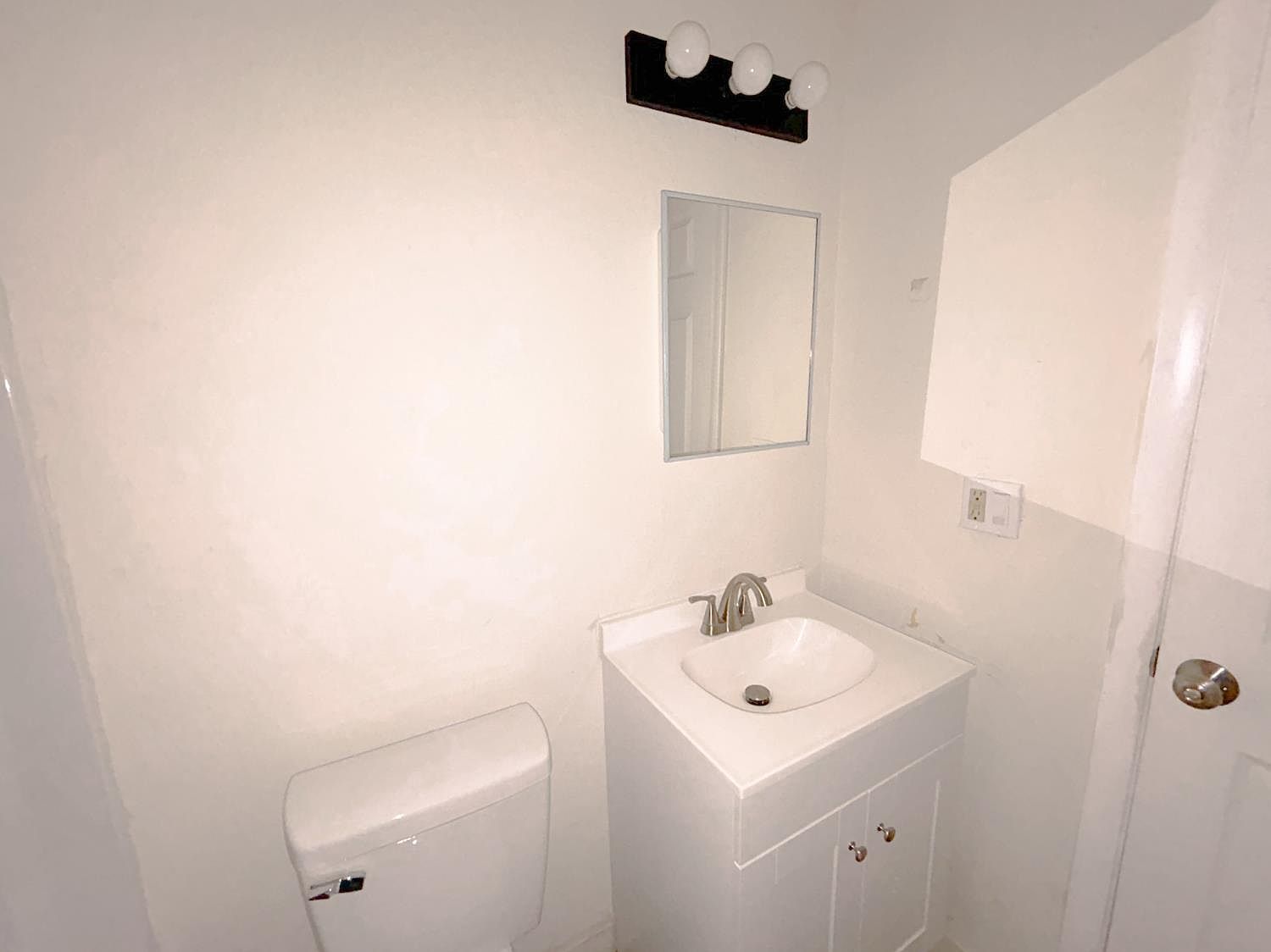 Bathroom vanity with new light fixture
