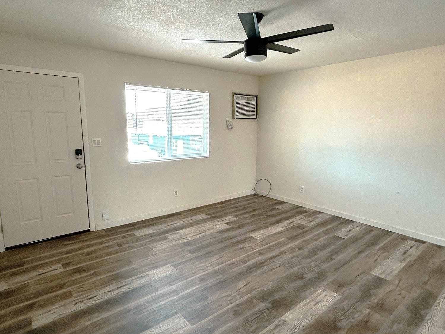 Living room with front entry door