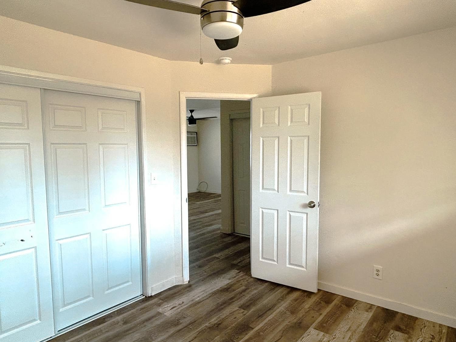 Bedroom with closet and hallway door