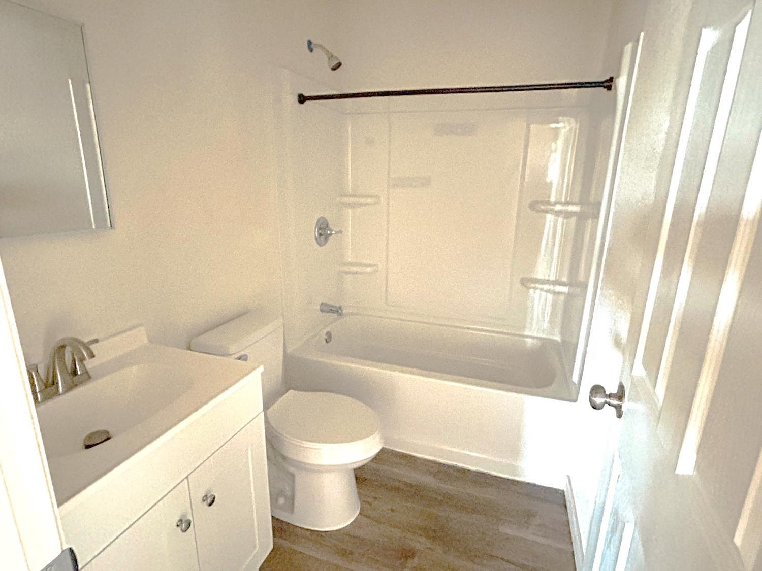 Refreshed bathroom with new vanity and tub-shower