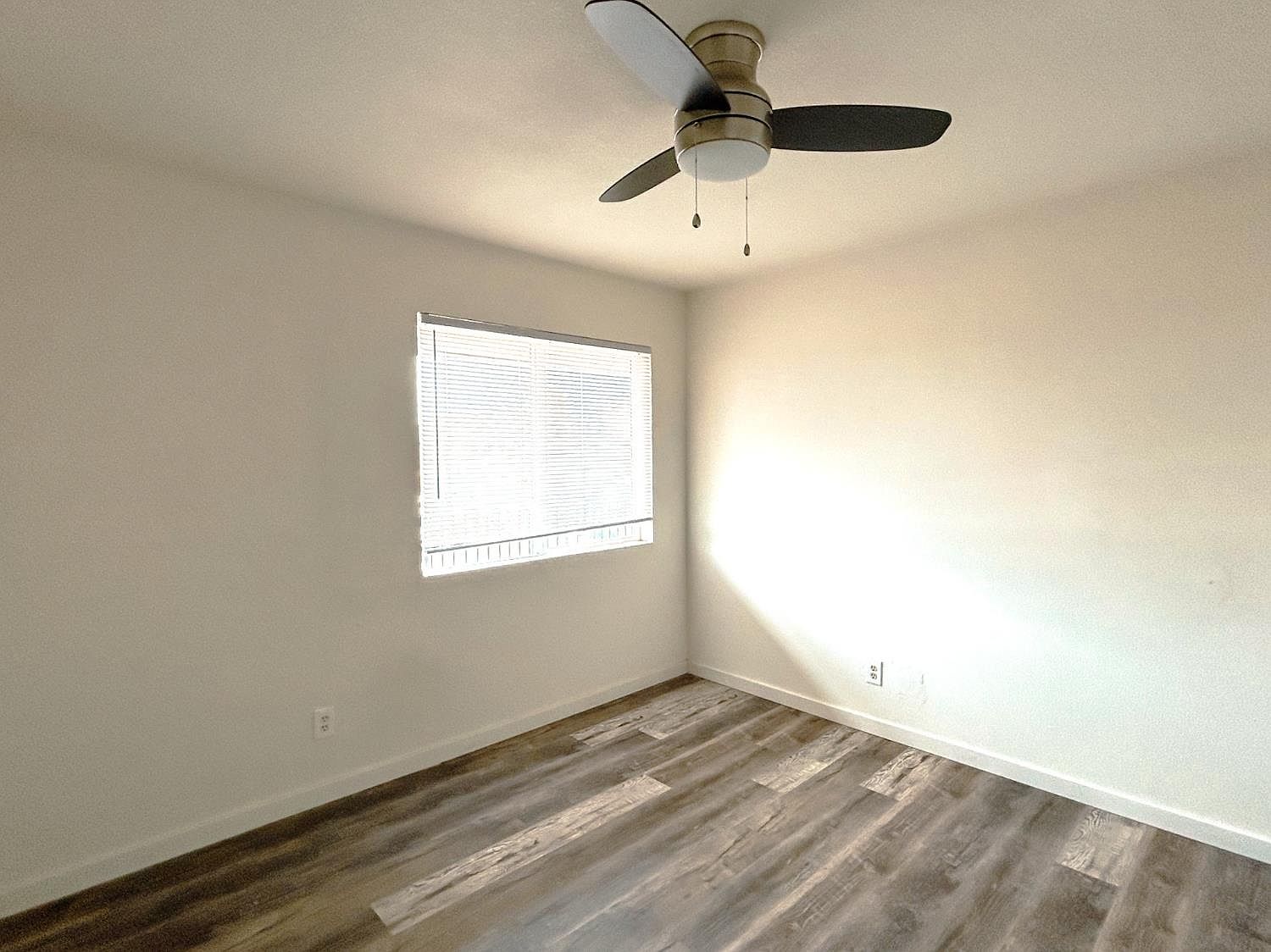 Bedroom with window and ceiling fan